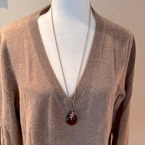 Pendant Necklace with burgundy stone and cherub charm